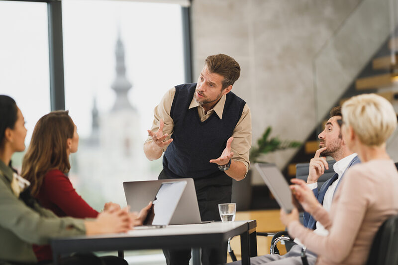 An experienced team member coaching colleagues during a training session